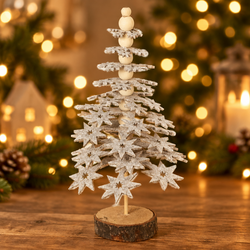 Star Christmas tree decoration with tiered felt stars displayed on a wooden surface with warm golden bokeh fairy lights in the background