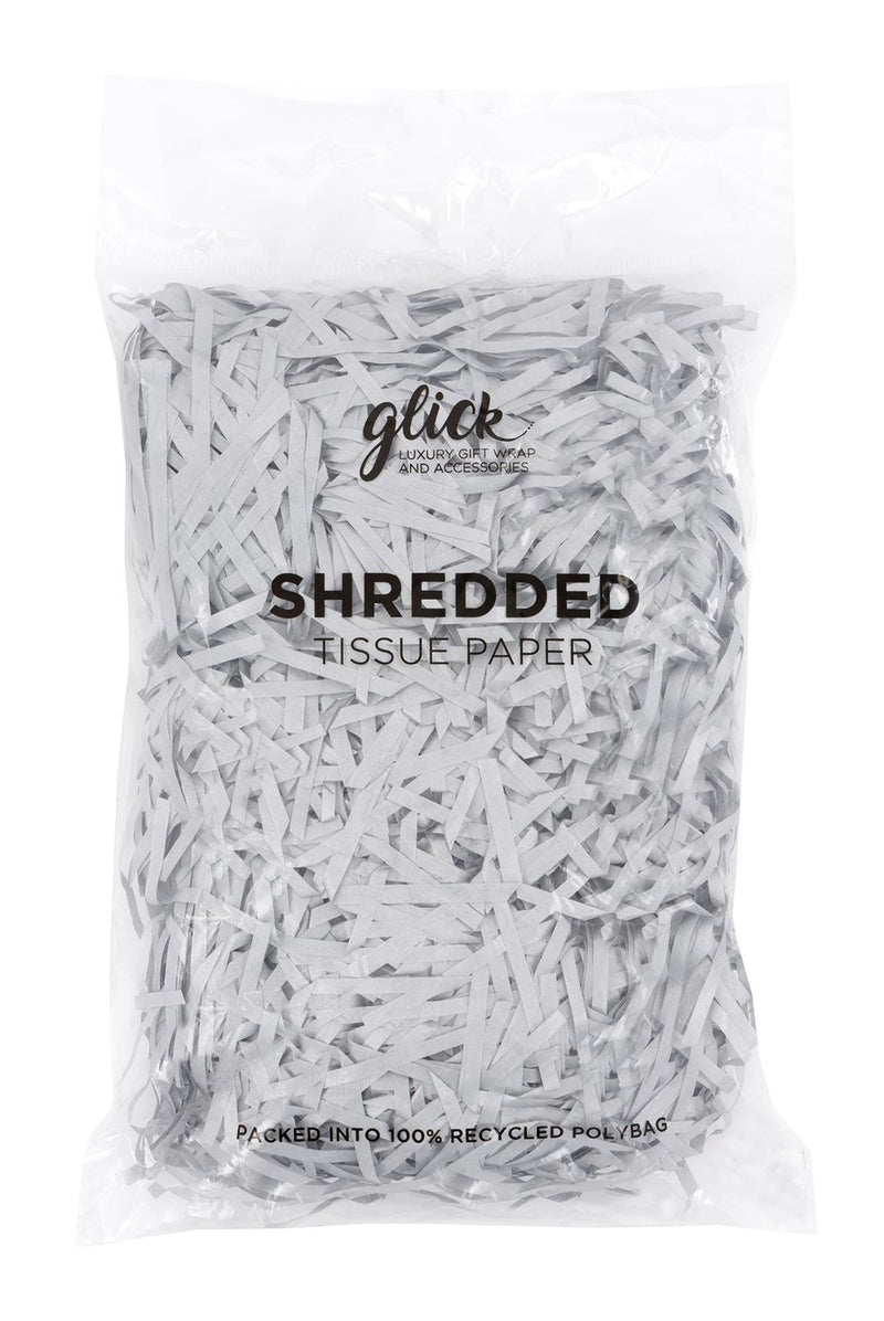 Shredded metallic silver tissue paper in a clear 100% recycled polybag on white background