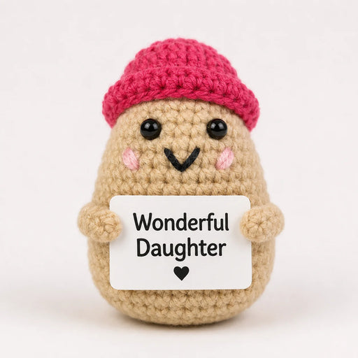 Wonderful Daughter Positive Crochet Gift character wearing a pink beanie hat and holding a Wonderful Daughter sign, presented on a white background