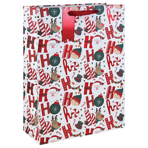 Extra large Christmas gift bag with Ho Ho Ho design featuring Santa, reindeer, elf, candy canes and baubles on white background with red ribbon handles