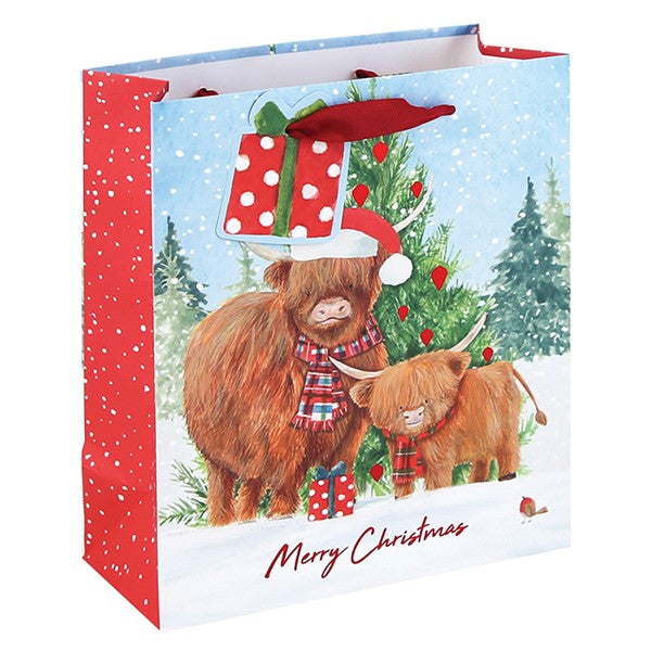 Medium Christmas gift bag with highland cow and calf in tartan scarves and Santa hat, snow-dusted Christmas tree, Merry Christmas text, red snowflake side panel
