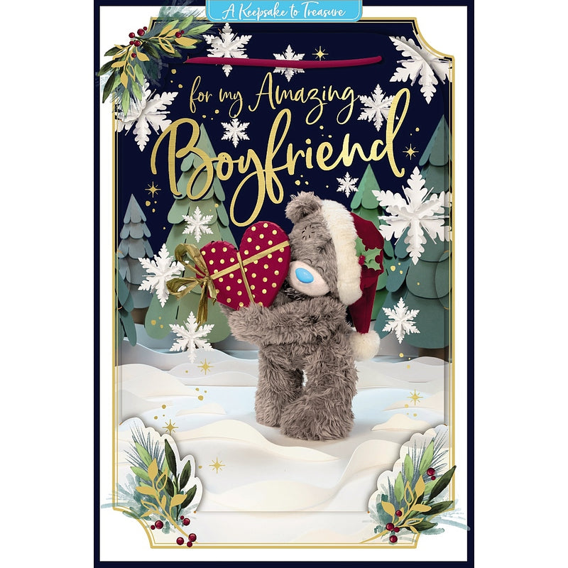 Amazing Boyfriend 3D-effect Christmas card featuring Tatty Teddy in a Santa hat holding a heart-shaped present tied with a bow, surrounded by Christmas trees, snowflakes and festive foliage.