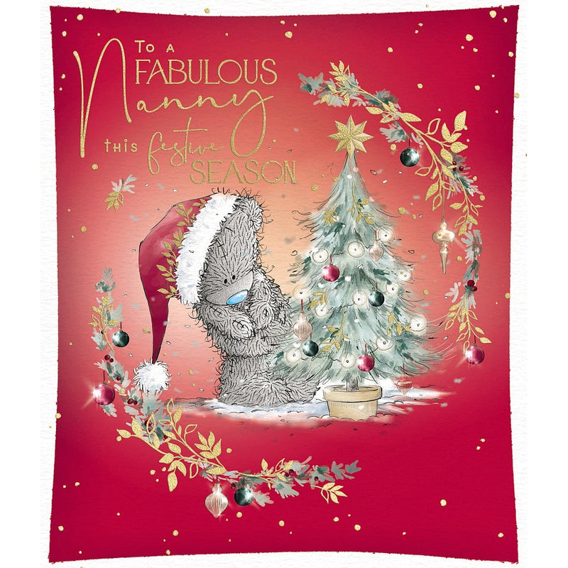 Fabulous Nanny Tatty Teddy Christmas card featuring a bear wearing a Santa hat beside a decorated Christmas tree topped with a star, framed by festive foliage and hanging baubles