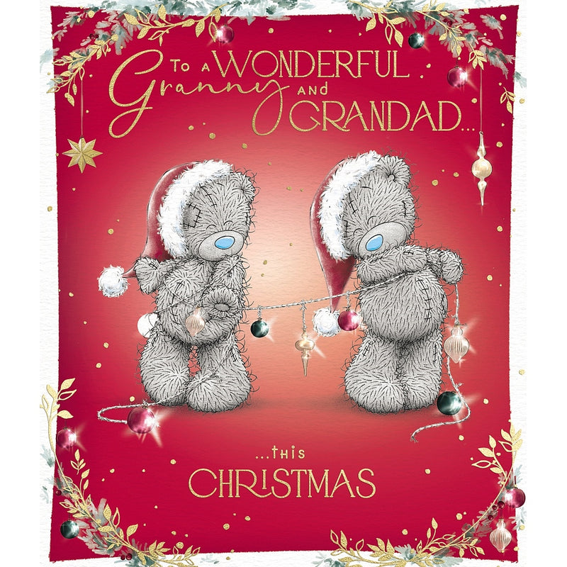 Wonderful Granny and Grandad Christmas card featuring two Tatty Teddy bears in Santa hats holding a string of baubles, framed by festive foliage and hanging decorations.