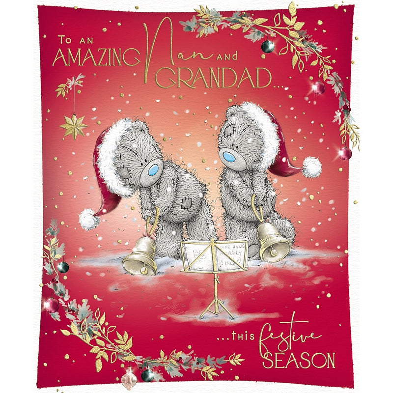 Tatty Teddy Nan and Grandad Christmas card featuring two bears in Santa hats ringing handbells beside a music stand, framed by festive foliage and baubles.