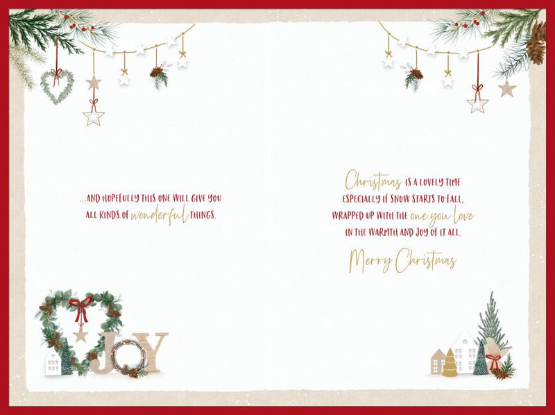 Inside of Special Couple Christmas card showing the Christmas verse and Merry Christmas greeting, bordered by festive foliage, hanging stars, little houses and Christmas trees.