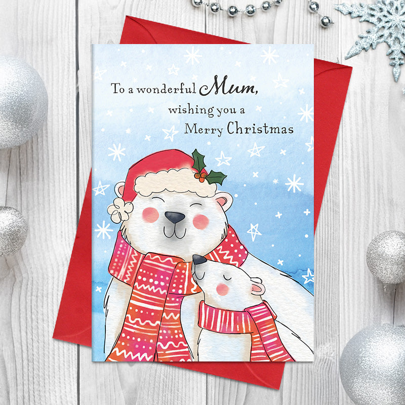 Wonderful Mum Christmas card featuring an illustrated polar bear and cub snuggling together in patterned scarves, with the larger bear wearing a holly-trimmed Santa hat, surrounded by snowflakes and stars
