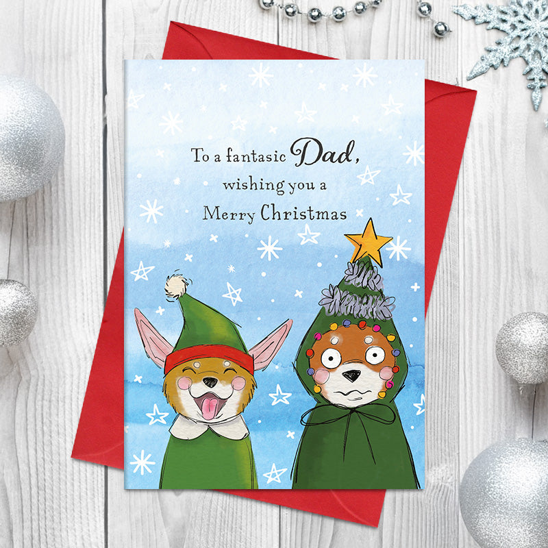 Fantastic Dad Merry Christmas card featuring two illustrated characters dressed as an elf and a Christmas tree, surrounded by stars and snowflakes.
