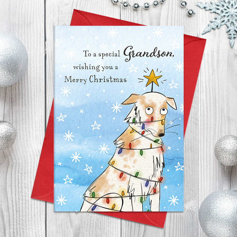 Special Grandson Christmas card featuring a wide-eyed illustrated dog wrapped in Christmas lights, with a star on its head and snowflakes around it.
