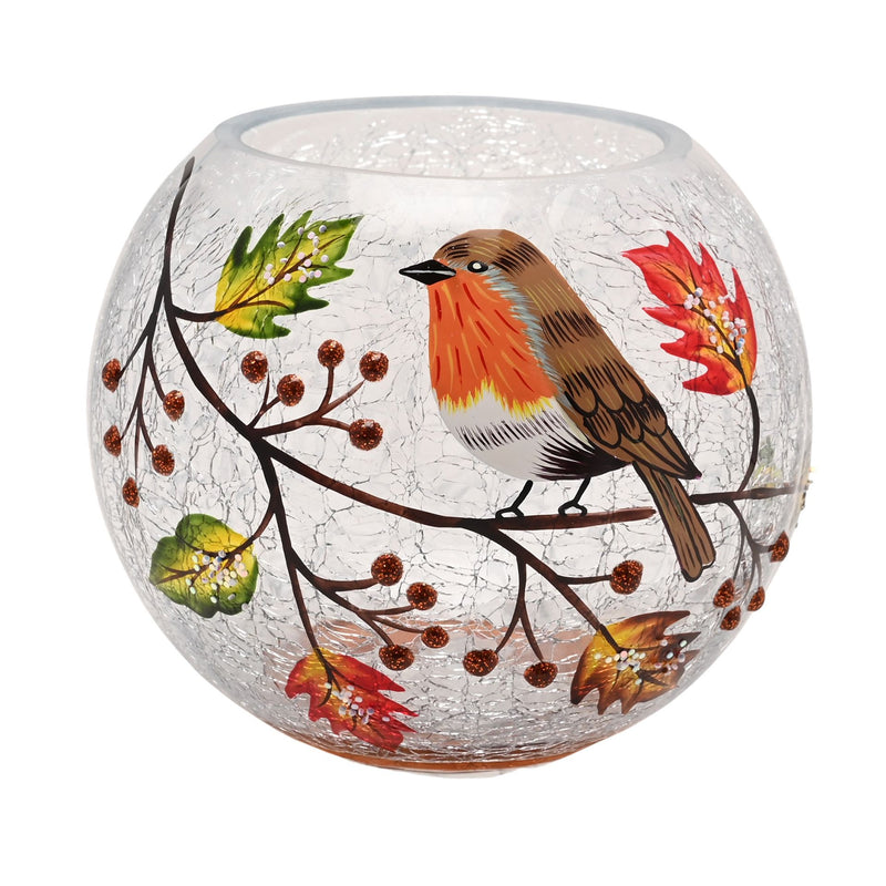 A round crackle glass votive holder with a hand-painted robin perched on a berry branch with autumn leaves and berries, unlit, front view on a white background