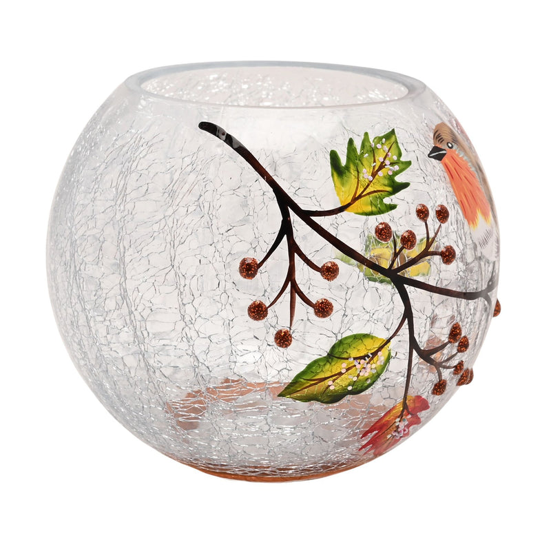 A round crackle glass votive holder with hand-painted berry branch, autumn leaves and a partial view of a robin, side view on a white background
