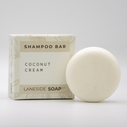 Laneside Soap Co Coconut Cream Shampoo Bar 60g alongside its cream box on a light grey background