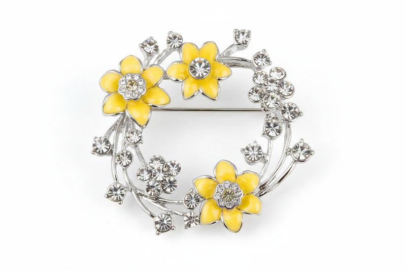 Equilibrium Radiant Daffodil Round Brooch with yellow daffodil flowers and crystal-effect stones on white background