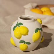 Hestia white ceramic vase with lemon design 12cm, styled next to a bowl of fresh lemons