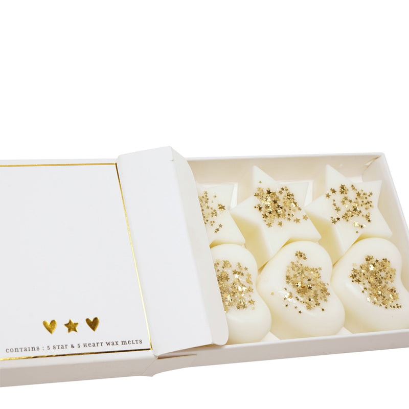 The Little Things Wax Melts Mum gift box open showing star and heart-shaped ivory wax melts with gold star confetti arranged inside