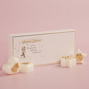 The Little Things Wax Melts Someone Special gift box with gold border and illustrated figure, star and heart wax melts with gold confetti displayed on pink background