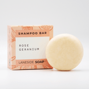 Laneside Soap Co Rose Geranium Shampoo Bar 60g alongside its floral-patterned box on a white background