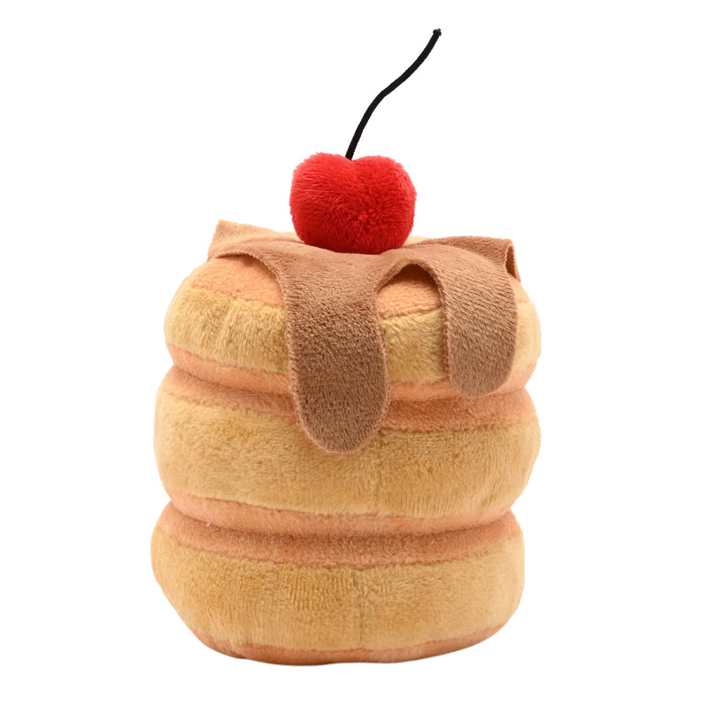 Back view of a soft plush pancake stack toy with three golden pancakes, syrup drizzle detail and a fluffy red cherry on top, on a white background