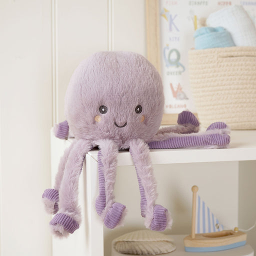 Otto the Octopus plush soft toy sitting on a shelf in a child's bedroom