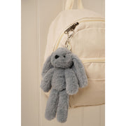 Sonny the Plush Blue Bunny softie keyring styled on a bag 