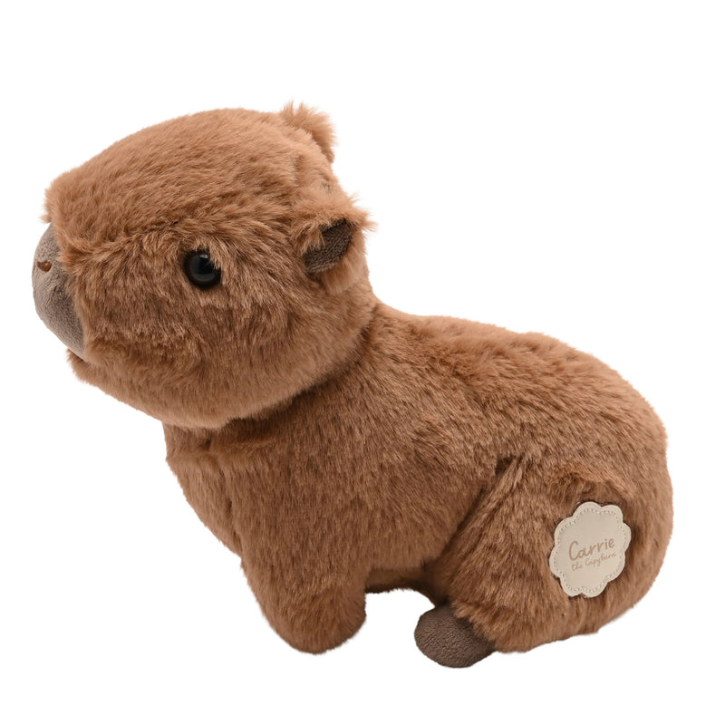 Carrie the Capybara plush soft toy 24cm, side view showing rounded body, small ears and dark fluffy feet, white background