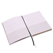 Serenity 5 Minute Journal open showing structured gratitude and intention pages, plain background