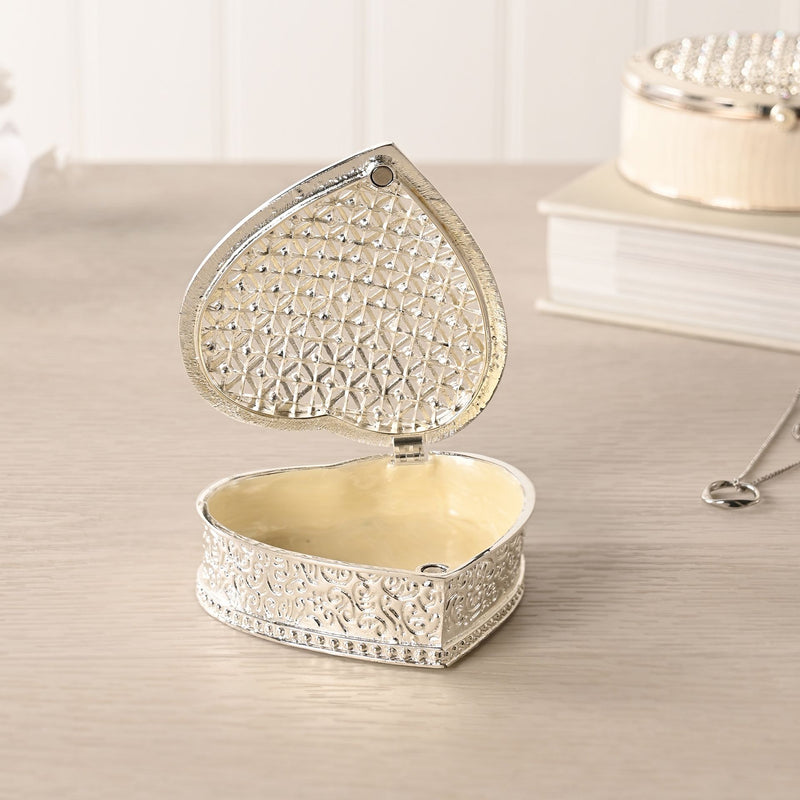 Sophia heart trinket box open on dressing table with necklace, lifestyle shot showing cream-lined interior and embossed floral scroll sides