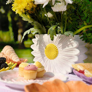 The Cottage Garden daisy ceramic vase by CELEBRATIONS, lifestyle shot — filled with flowers in an afternoon tea setting