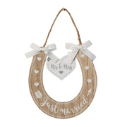 Just Married Wooden Horseshoe Hanging Plaque with Mr and Mrs heart tag, ribbon bows, painted hearts and arrow details, jute twine hanger, white background