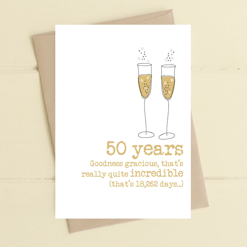 50th golden wedding anniversary card with two illustrated champagne flutes in gold and the message "50 years, goodness gracious, that's really quite incredible (that's 18,262 days…)"