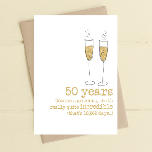 50th golden wedding anniversary card with two illustrated champagne flutes in gold and the message "50 years, goodness gracious, that's really quite incredible (that's 18,262 days…)"